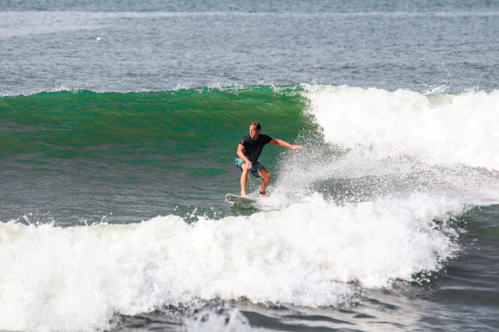 SurfWG Bali guest riding a wave