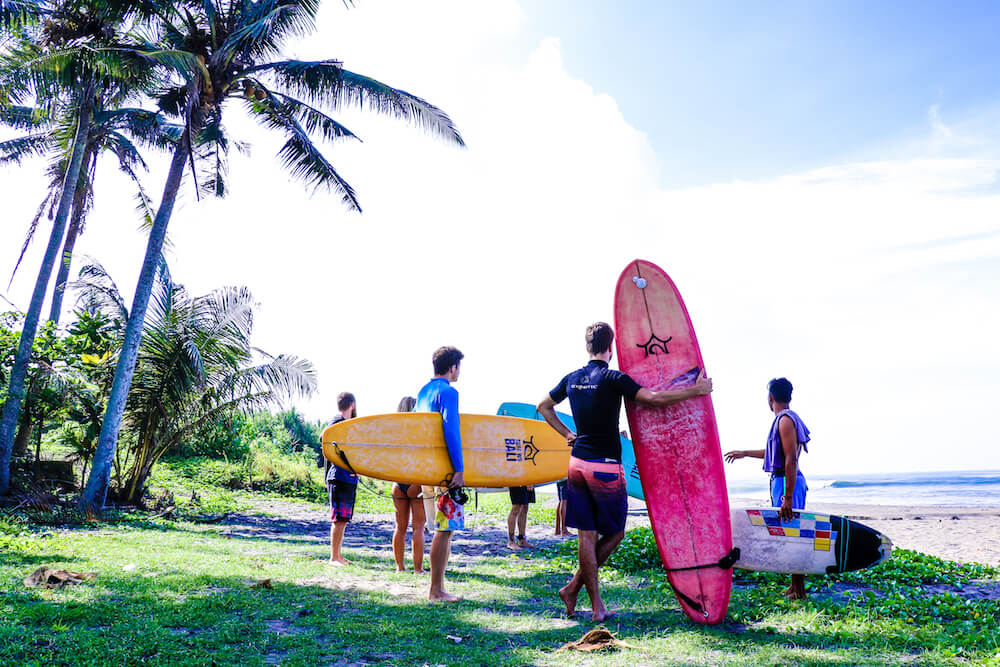 SurfWG Bali on the way to the beach colorful boards Learn to surf with SurfWG beginner surf class in Bali
