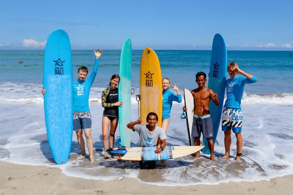 SurfWG surf camp Bali guides and guests on the beach