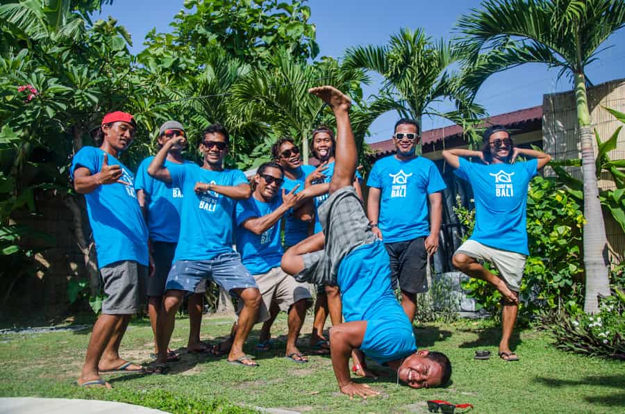 SurfWG surf camp guides with blue SurfWG shirts making fun