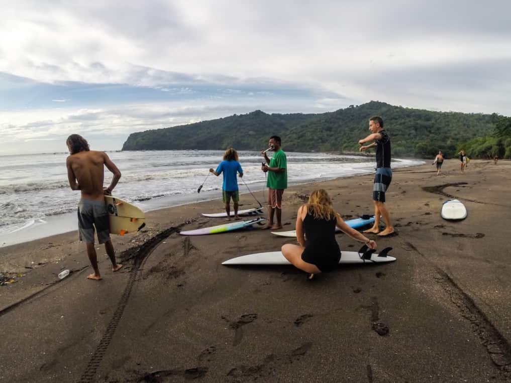 Group of surfers from SurfWg bali surf camp preparing the surf in java